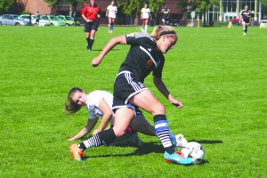 A Treasure Valley player sneaks by NIC's Haley White