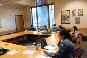 Students gather in a study room in the library to study Biology and Physics.