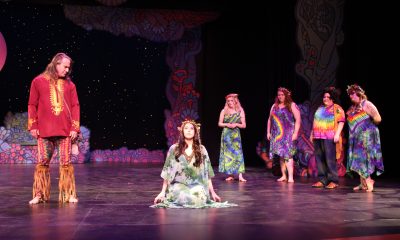 The king of the fairies, Oberon (Geoff Carr), confronts the queen,Titania (Taylor Wenglikowski), while the fairies (Kendra Marquardt, Yona Soltis, Dimitri Tucker and Hannah James) observe.