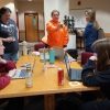 Students making buttons at FUNbrary event at the Molstead Library.